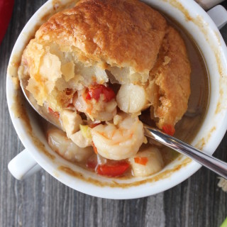 thai seafood pot pie spoon