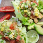 lettuce fish tacos on cutting board