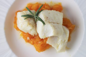 poached cod on plate